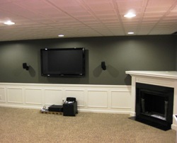 Finished Basement with wainscoting, custom fireplace and wine bar!